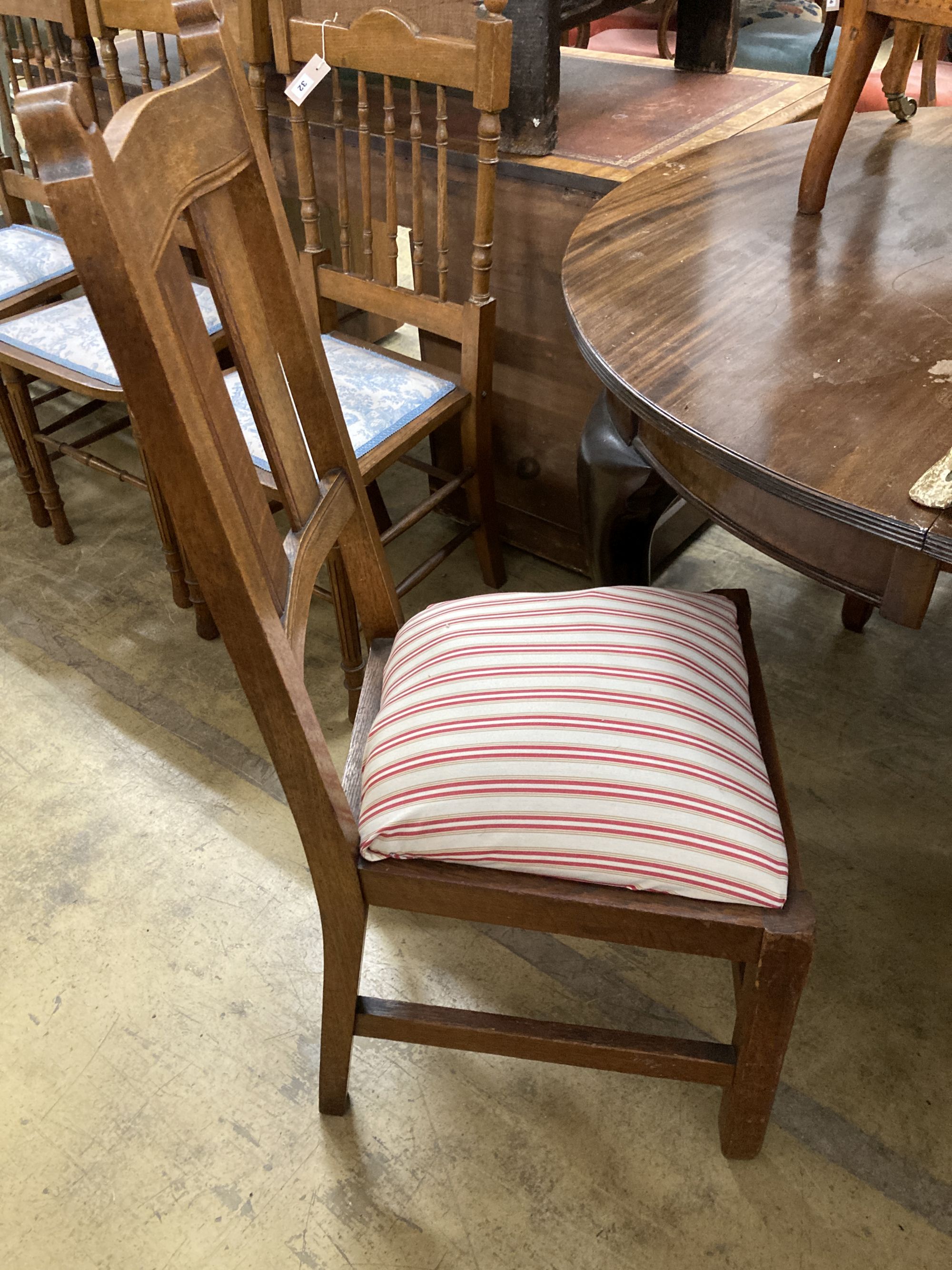 A set of six early 20th century oak Arts & Crafts style dining chairs